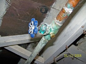A Leaking Copper Fitting in a Crawlspace.