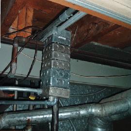Why use just one electrical junction box, when 8 looks much better? Rather than adding a little more conduit pipe, and doing the installation correctly, they chose to just keep adding boxes until the space was filled.